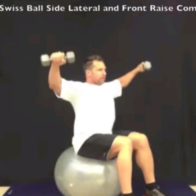 Alternating Lateral And Front Dumbell Raises On Stability Ball. by