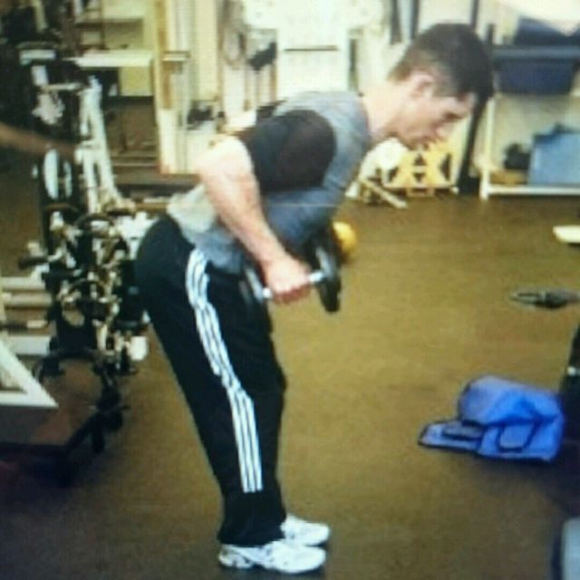 Standing DB Row and Kickback by Tony S. Exercise Howto Skimble